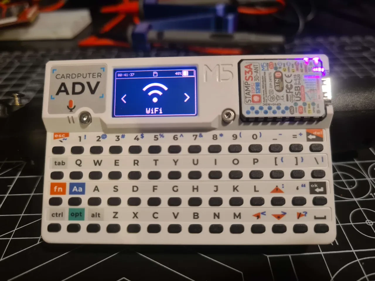 White Cardputer ADV handheld computer showing its Wi-Fi menu